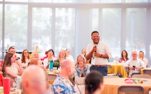 A man stands up and responds during a workshop