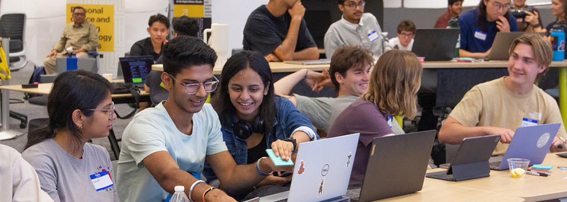 Students in class with laptops.