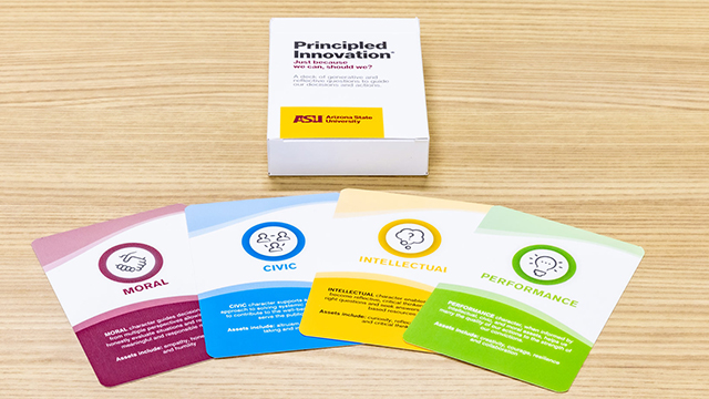 Four cards from the PI card deck fanned out on a table